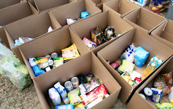 Food collected in individual boxes for in-kind donation.